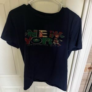 Blue New York shirt.